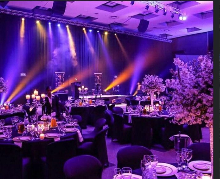 Corporate awards dinner with purple architectural lighting